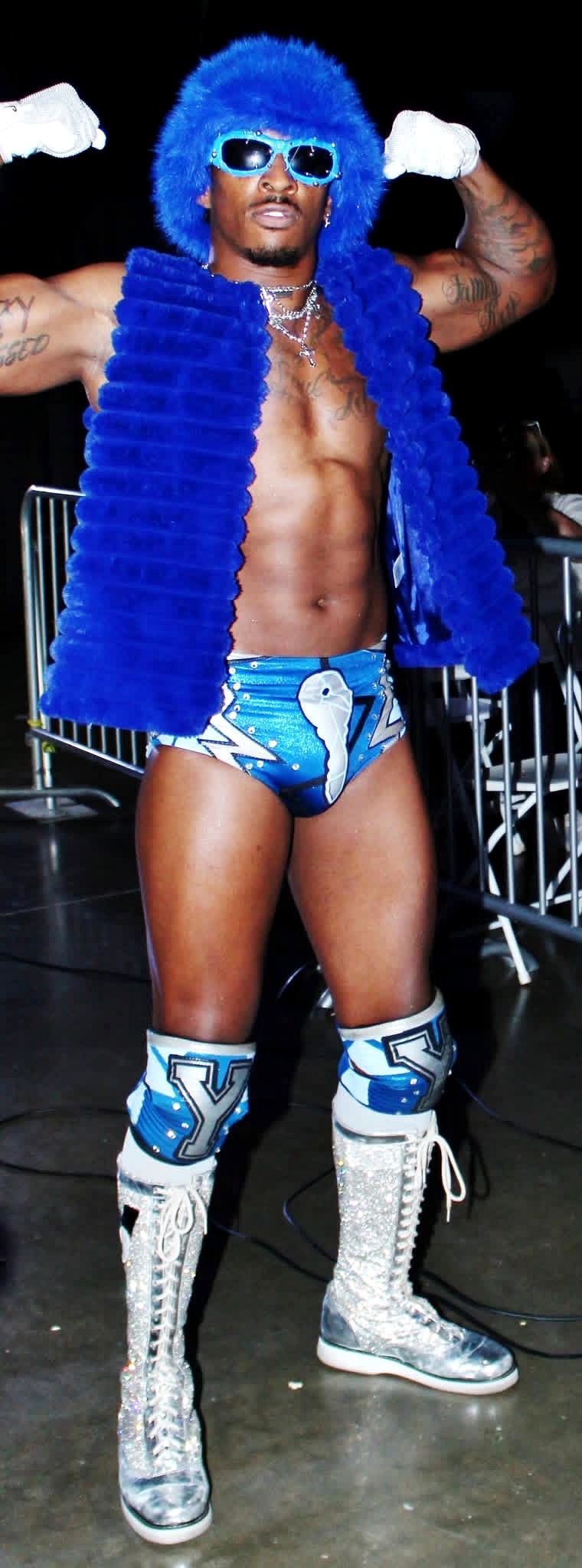 YKies in blue wrestling gear