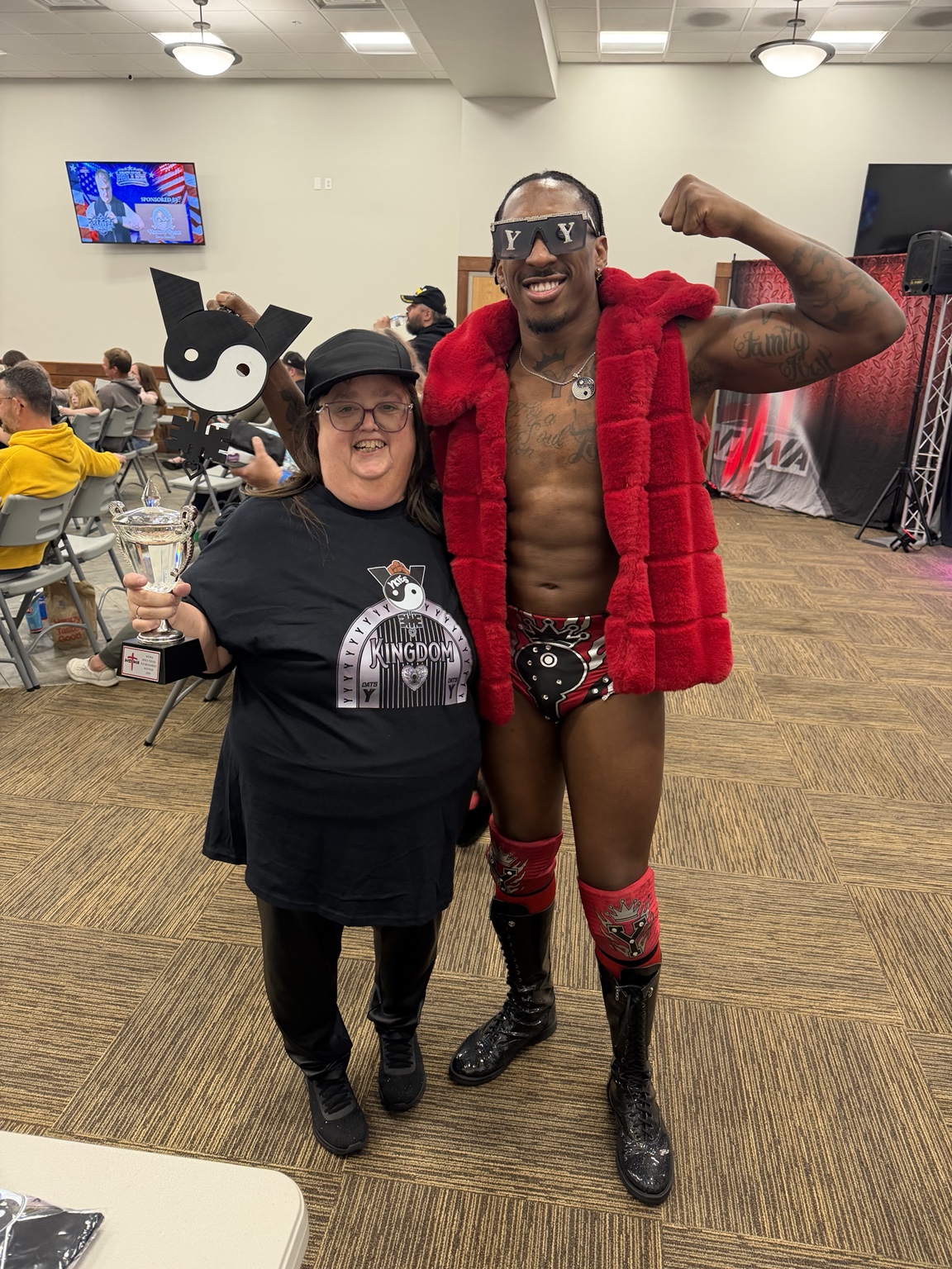 YKies with a fan wearing Kingdom merchandise