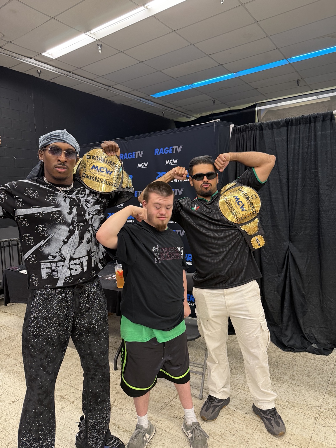 YKies and tag team partner with a fan